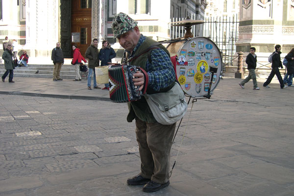 Crazy musician.. (600Wx400H) - A crazy, amazing musician in Piazza del Duomo...(we paid 50 cents for this picture! (Photo by Marco De La Pierre and Breena Kerr) 